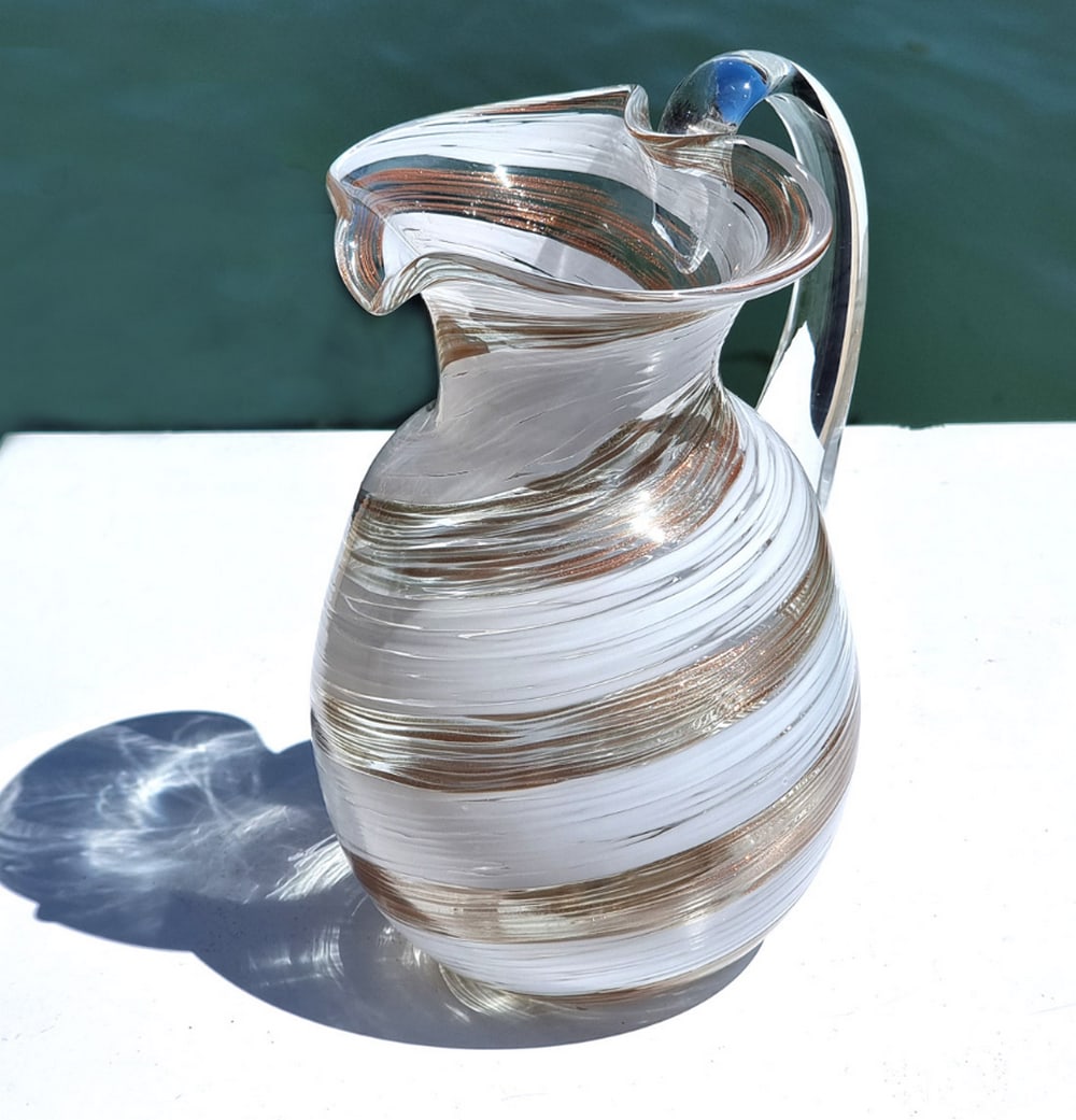 Handblown White Helix Murano Pitcher: Handblown White Helix Murano Pitcher This handblown carafe features delicate avventurina decoration, incorporating fine glass fragments to create subtle shimmering color accents. Ideal for everyday us
