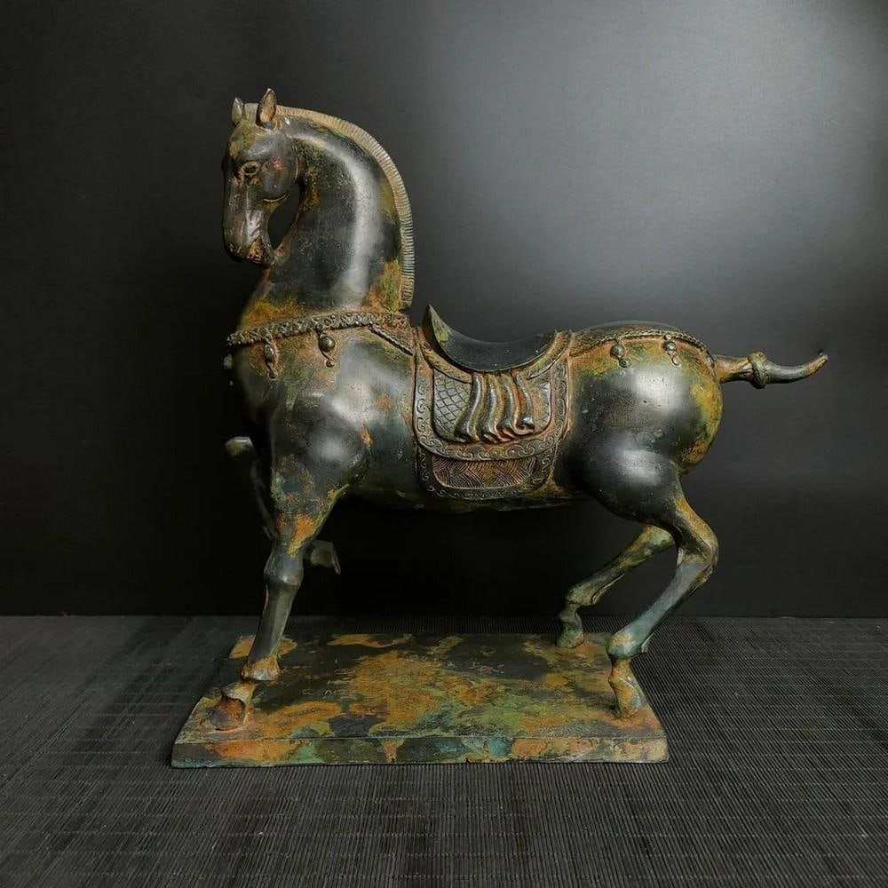 Antique Chinese Officer's Horse Bronze Statue: Antique Chinese Officer's Horse Bronze Statue This antique Chinese bronze statue depicts an officer's horse, symbolizing strength, loyalty, and prestige. The intricate detailing captures the h