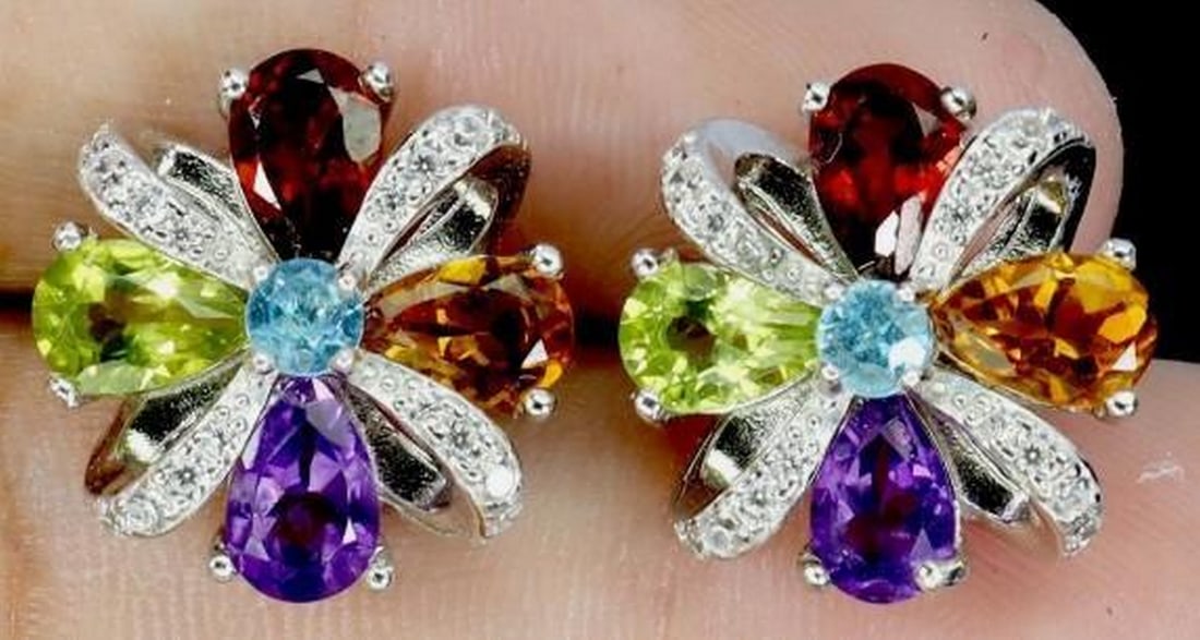 925 Sterling Silver Earrings: 925 Sterling Silver Earrings These elegant 925 sterling silver earrings feature luminous pear-cut gemstones. These earrings are beautifully crafted with rich purple amethyst, warm golden glow citrine,