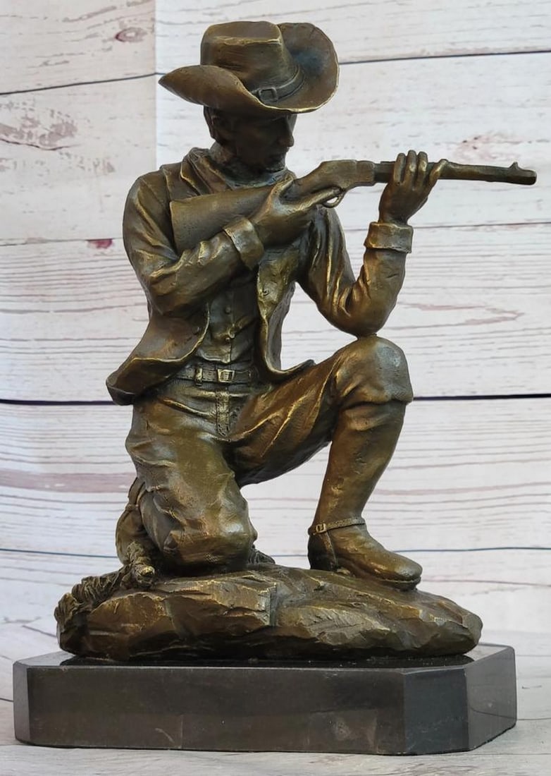 Figure of a Kneeling Ranger With Rifle Bronze Sculpture - 11" x 8": Figure of a Kneeling Ranger With Rifle Bronze Sculpture - 11" x 8" Here is a wonderful sculpture of a Cowboy shooting a rifle in the old west, in mid-run shooting range with his arch enemy. Th