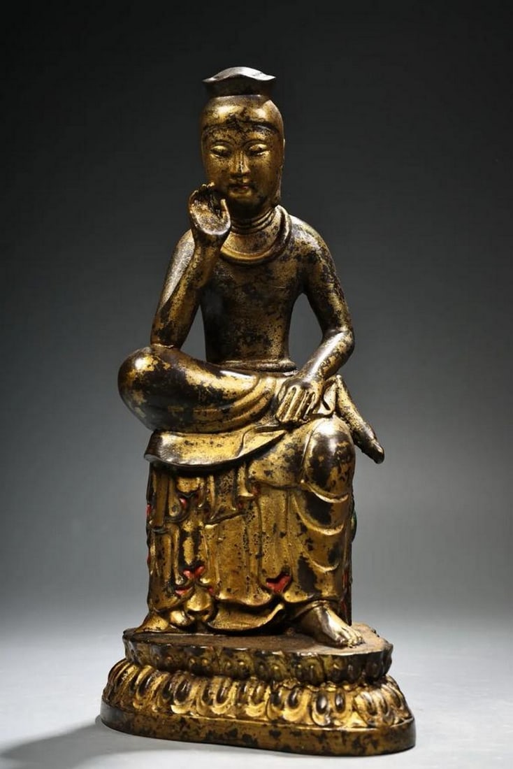 Thinking Guanyin Bodhisattva in Chiseled Mud-Gold Copper: Thinking Guanyin Bodhisattva in Chiseled Mud-Gold Copper This exceptional antique statue captures the contemplative elegance of the Thinking Guanyin Bodhisattva, rendered in high relief from pure