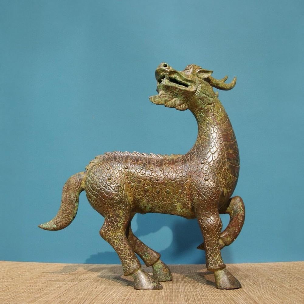 Antique Chinese Bronze Dragon-Head Horse Statue Ornament: Antique Chinese Bronze Dragon-Head Horse Statue Ornament This rare handcrafted bronze statue features a majestic horse with a dragon-inspired head and intricate inscriptions, symbolizing strength and