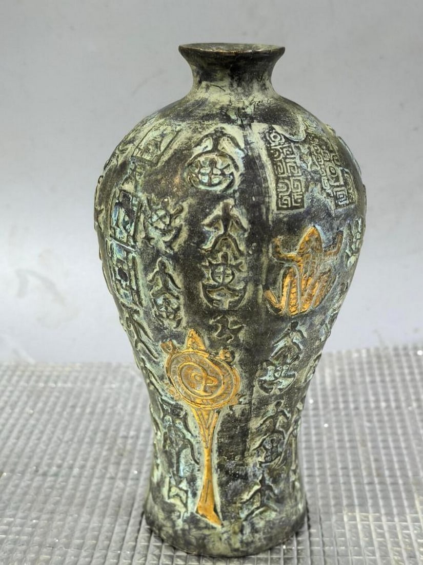 Bronze High-Relief Qilin Vase: Bronze High-Relief Qilin Vase This exquisite antique vase showcases intricate high-relief craftsmanship, featuring the revered Qilin, a symbol of prosperity and protection in Chinese culture.