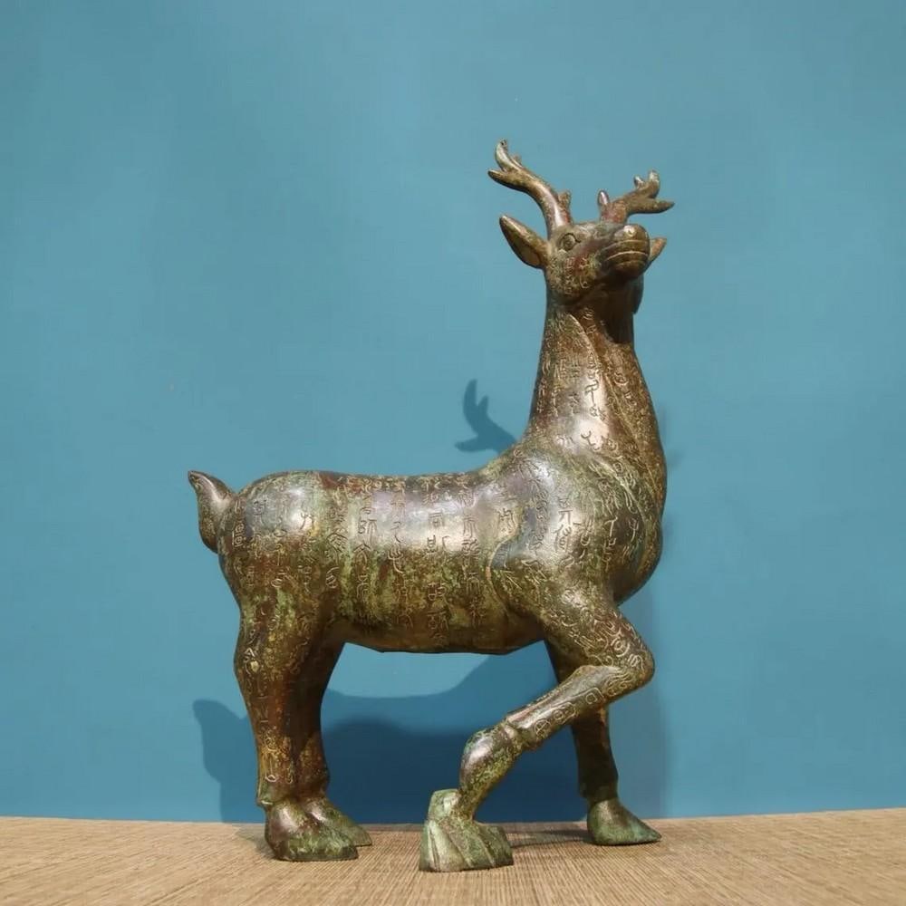 Chinese Handmade Bronze Inscribed Deer Statue: Chinese Handmade Bronze Inscribed Deer Statue This exquisite handmade bronze deer statue is a rare masterpiece of traditional Chinese artistry. The deer, a symbol of longevity and peace, is intricatel