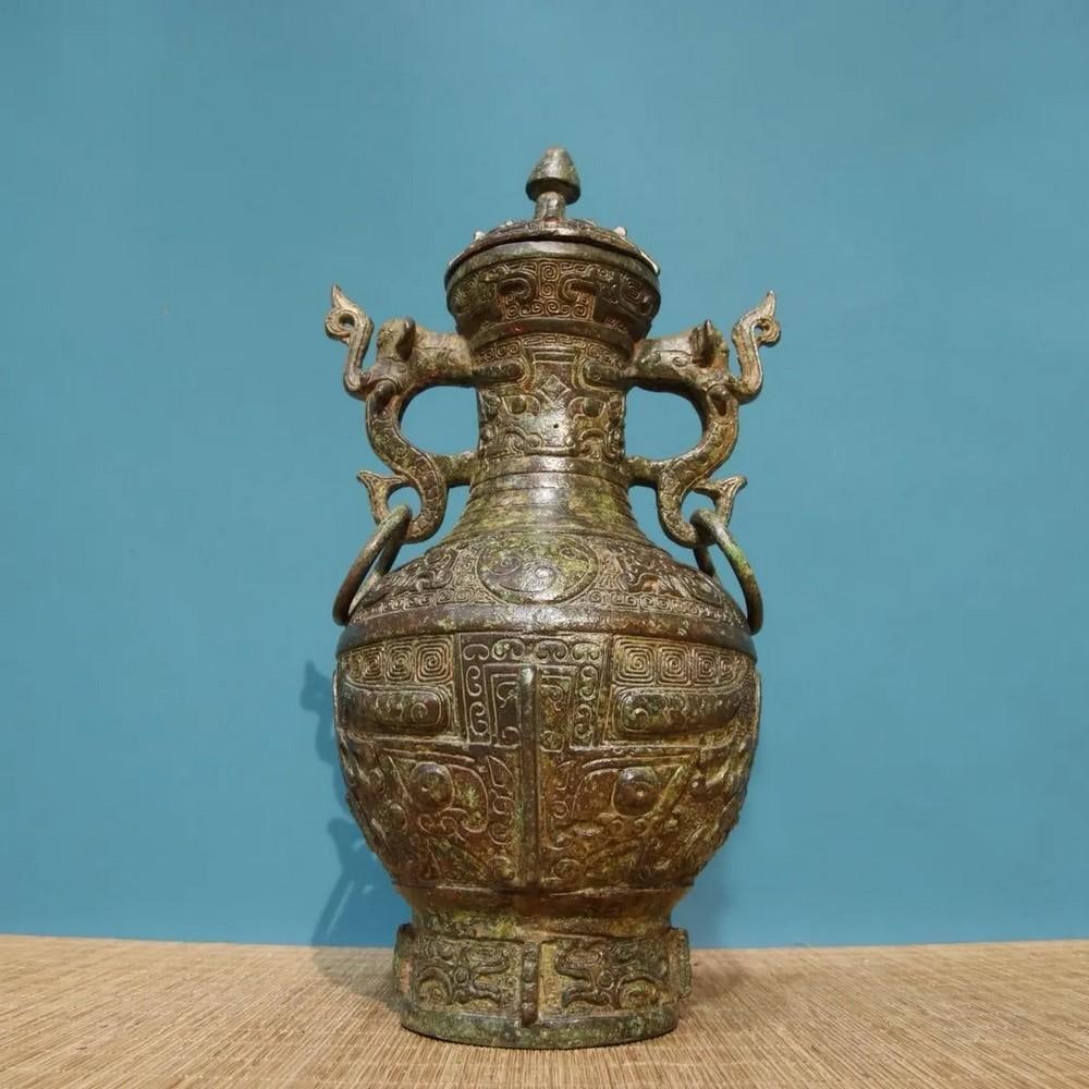 Chinese Handmade Bronze Inscribed Beast-Faced Double Dragon Bottle Statue: Chinese Handmade Bronze Inscribed Beast-Faced Double Dragon Bottle Statue This rare and exquisite handmade bronze bottle statue features an intricate design of two powerful dragons intertwined with a 