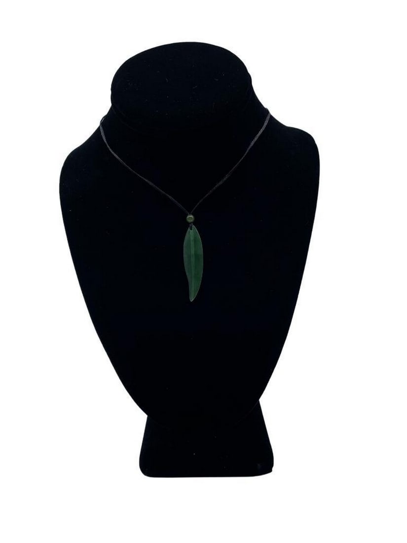 Jade Leaf Pendant Necklace: Jade Leaf Pendant Necklace Add this stunning jade leaf pendant necklace to your collection. This pendant is made of Canadian Nephrite Jade and is 11.5mm X 43mm with a satin polish finish. The