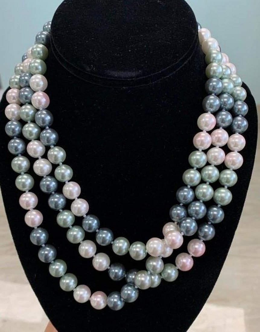 Pastel Symphony : Cascading Beads of Elegance: Pastel Symphony : Cascading Beads of Elegance This multi-strand necklace dances with polished beads in soft hues of pink, green, blue, and gray. Layered gracefully, each strand adds depth and charm,