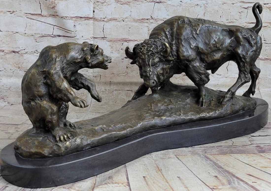 A Wild Encounter Battle of a Bear and Bison Bronze Sculpture - 9" x 21": A Wild Encounter Battle of a Bear and Bison Bronze Sculpture - 9" x 21" The American bison, often referred to as a buffalo, confronts the bear in a face-to-face standoff, their expressions etc