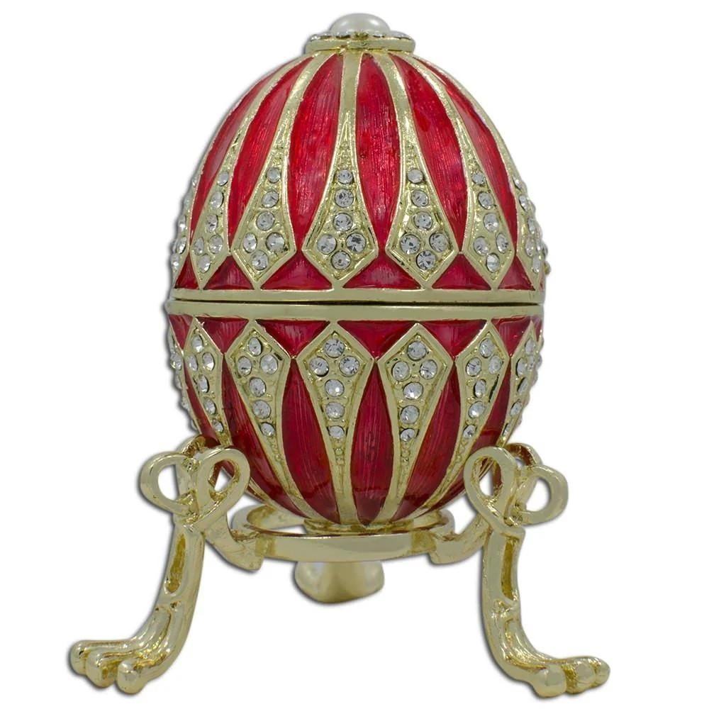Regal Red Enamel Jeweled Imperial Easter Egg: Regal Red Enamel Jeweled Imperial Easter Egg Crafted from pewter, this stunning egg is embellished with clear crystals and a glossy enamel finish accented by golden trim. It opens smoothly on a hinge