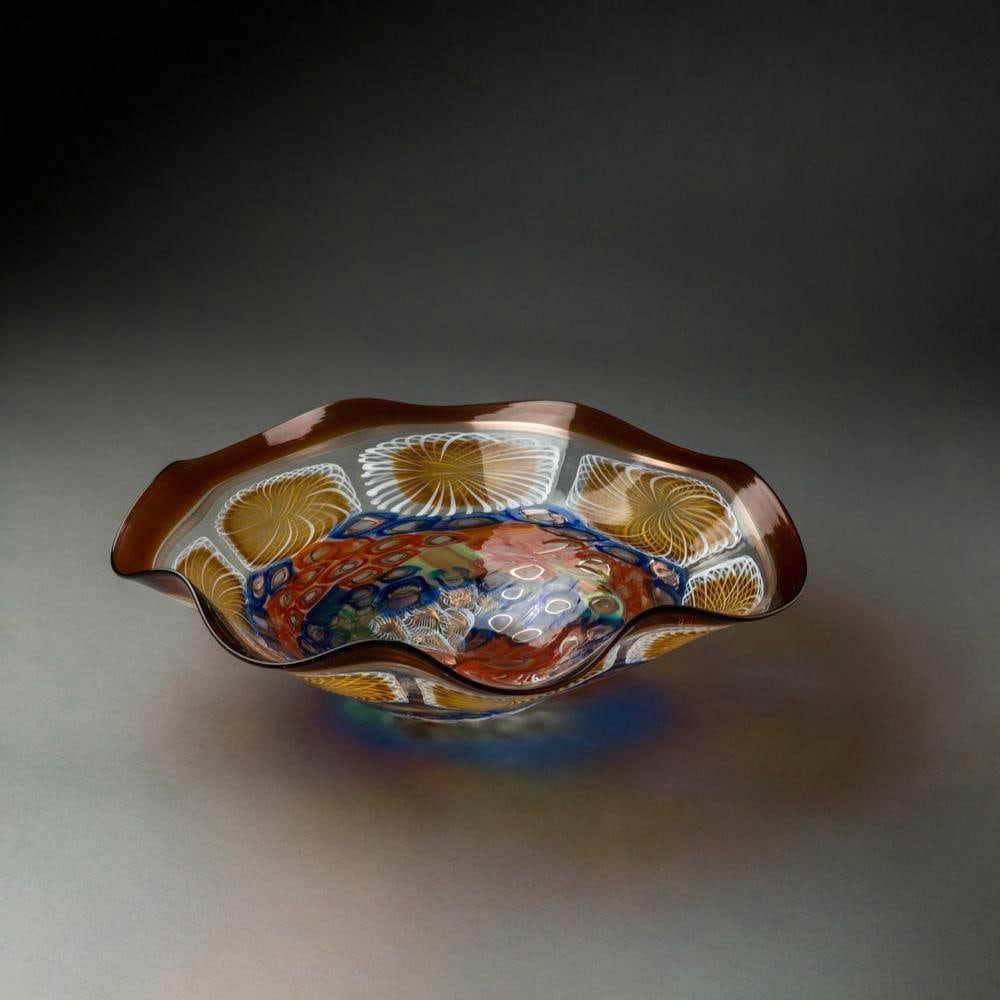 ‘Reliazzato’ Murano Glass Art Platter by Gianluca Vidal: ‘Reliazzato’ Murano Glass Art Platter by Gianluca Vidal This Murano glass art platter from the Reliazzato collection is designed by glassmaster Gianluca Vidal. The piece features an amber-toned ed