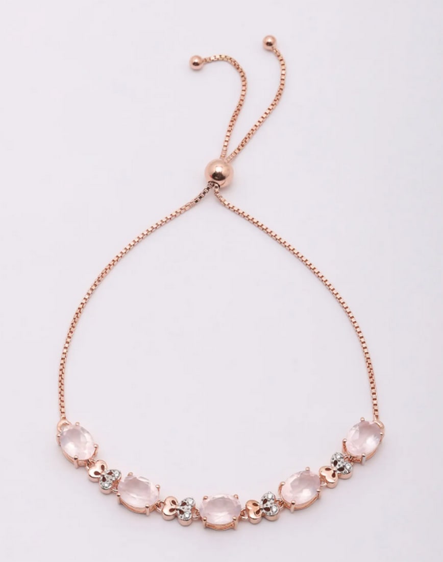 Rosé Radiance Quartz Bracelet: Rosé Radiance Quartz Bracelet Embrace elegance with this exquisite bracelet, featuring faceted rose quartz stones in a warm rose gold-plated sterling silver setting. Its delicate charm and timeless