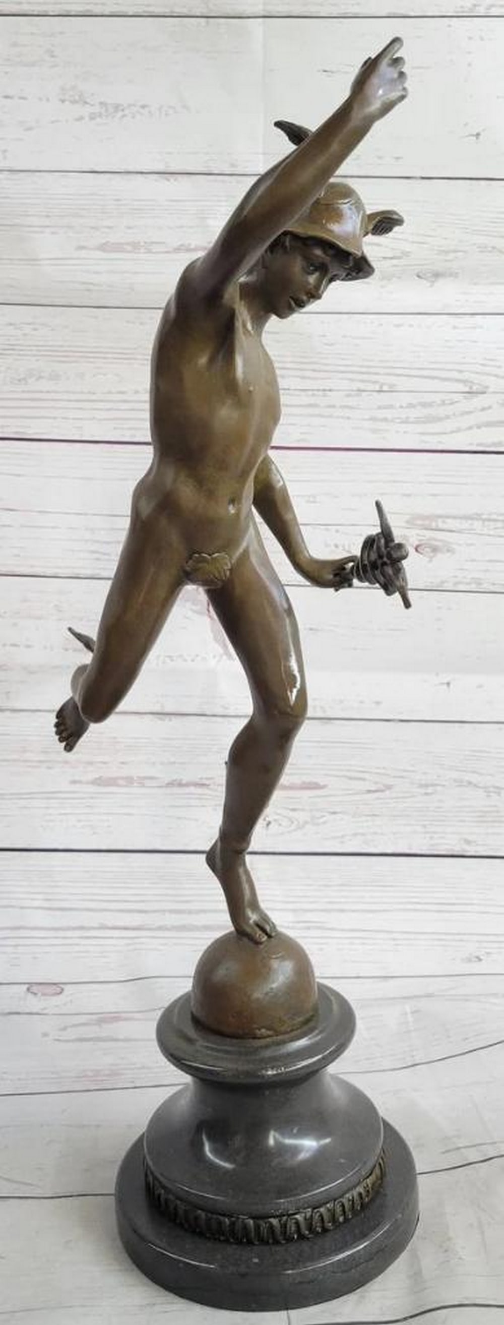 Nude Winged Mercury Inspired Bronze Sculpture by GIAMBOLOGNA - 21" x 11": Nude Winged Mercury Inspired Bronze Sculpture by GIAMBOLOGNA - 21" x 11" Immerse your space in the timeless beauty and dynamic movement captured by the "Nude Winged Mercury" bronze scu