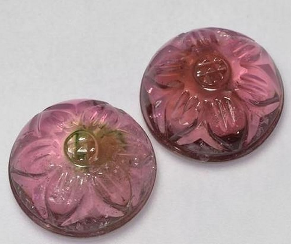 Set of Two Dark Pink Tourmaline Flower Carved Gemstones: Set of Two Dark Pink Tourmaline Flower Carved Gemstones This elegant pair of loose gemstones is carved from richly colored dark pink tourmaline, each shaped into a delicate blooming flower. The deep, 