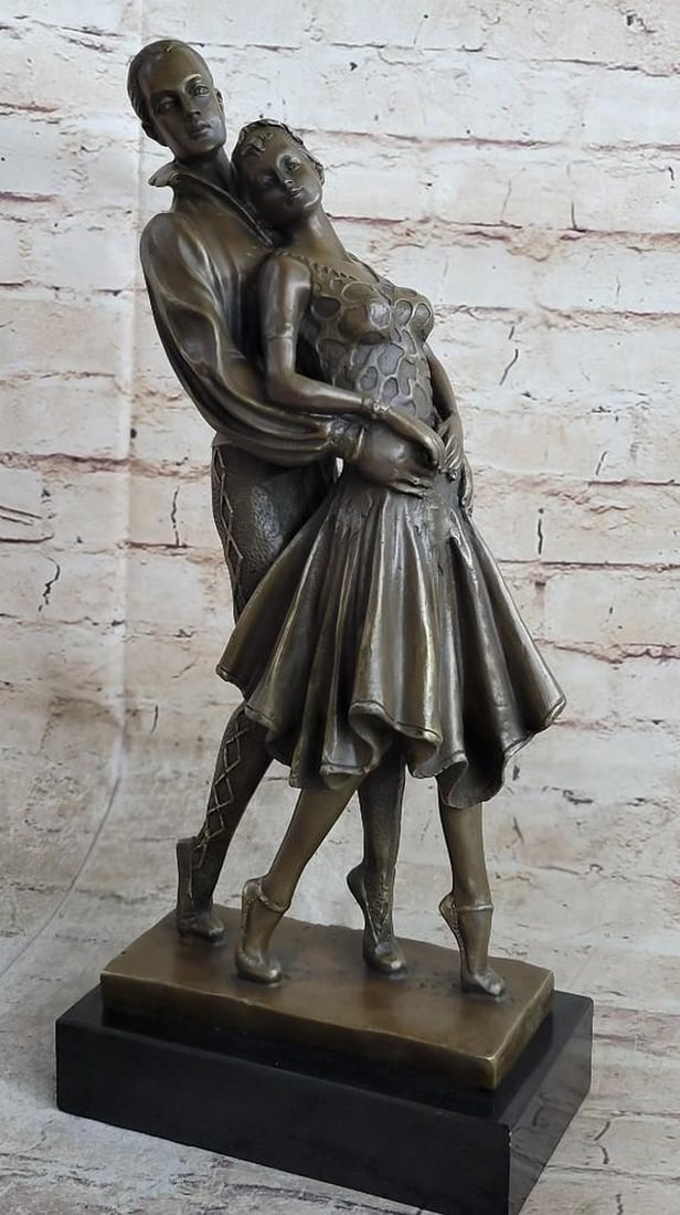 Embracing Loving Couple Bronze Sculpture: Embracing Loving Couple Bronze Sculpture This gorgeous piece of a couple dancing in unison is to die for. Her detailed dress shirt is more then the eye can handle, it is designed to leave you stunned 