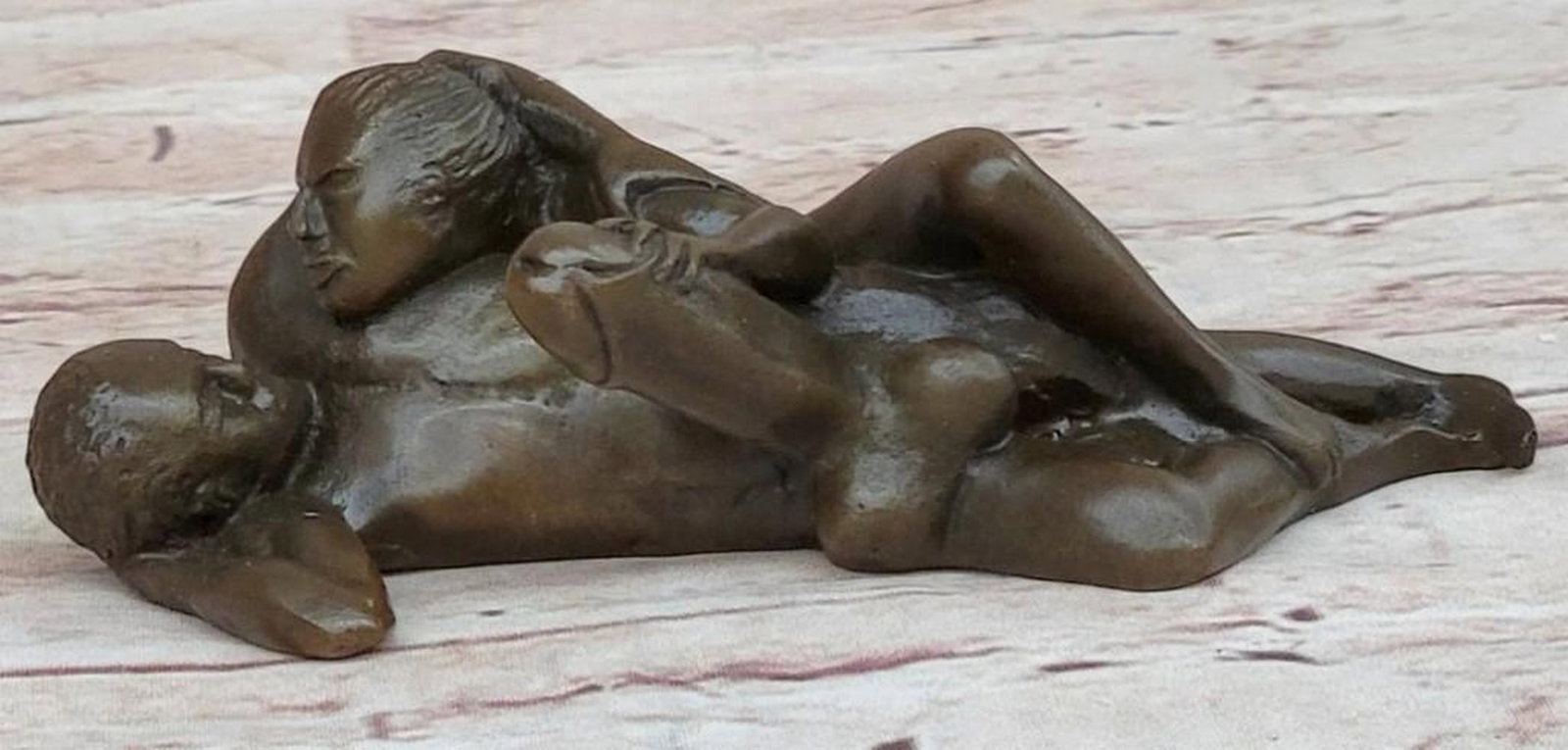 Abstract Nude Man and Woman Sculpture: Abstract Nude Man and Woman Sculpture This is an abstract bronze sculpture, bearing the signature of artist Milo, that captures the intimate connection between a man and a woman, their bodies morphing