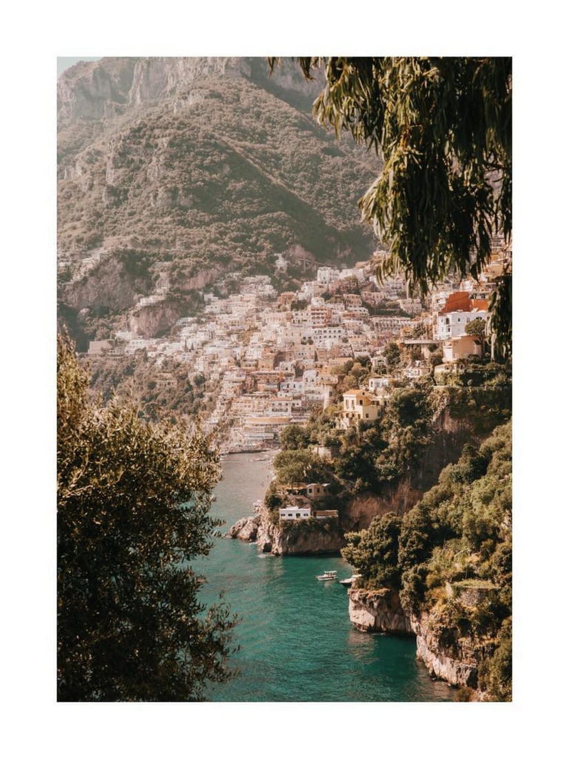 Positano Coastline Poster: Positano Coastline Poster A scenic print of Positano, featuring colorful hillside houses overlooking the turquoise waters of the Amalfi Coast. The vibrant tones and layered architecture capture the ch