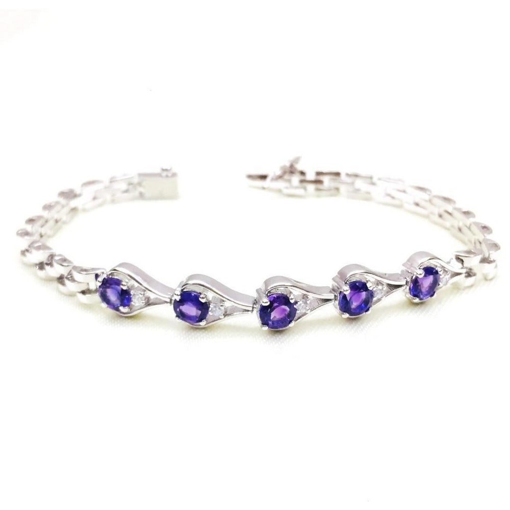 Round Faceted Amethyst and Zirconia Studded Bracelet: Round Faceted Amethyst Studded Bracelet This 925 Sterling Silver bracelet is studded with gorgeous purple amethyst which is associated with calmness and protection from negativity. Size of Gemstones: 