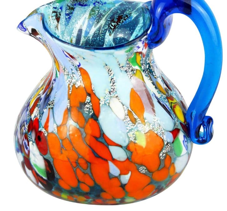 Pitcher in Light Blue Mixed Colors with Murrines Murano Glass: Pitcher in Light Blue Mixed Colors with Murrines Murano Glass Crafted using the traditional glassblowing technique with exquisite murrina decoration, this carafe is a true masterpiece, signed by the r