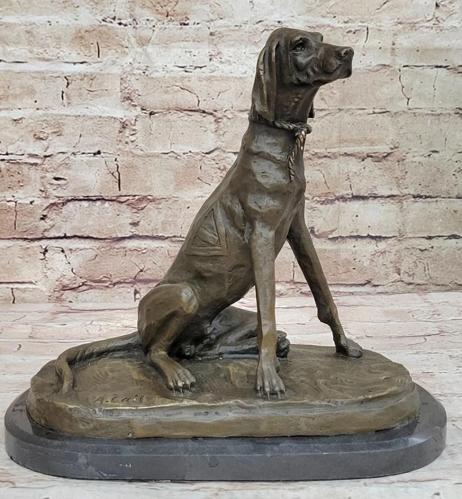 Inspired Bronze Vigilant Hound Sculpture - 10'' x 10'': Inspired Bronze Vigilant Hound Sculpture - 10" x 10" This striking bronze sculpture captures a golden-brown hound in a relaxed yet watchful pose, showcasing its sleek form, keen eyes, and gracef