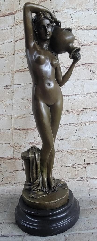 Bronze Nude Woman with Raised Arm Sculpture by Milo - 18'' x 7'': Bronze Nude Woman with Raised Arm Sculpture by Milo - 18" x 7" This conceptual bronze sculpture by Milo portrays a nude woman standing with one arm raised, holding a vase, her gaze fixed ahead i