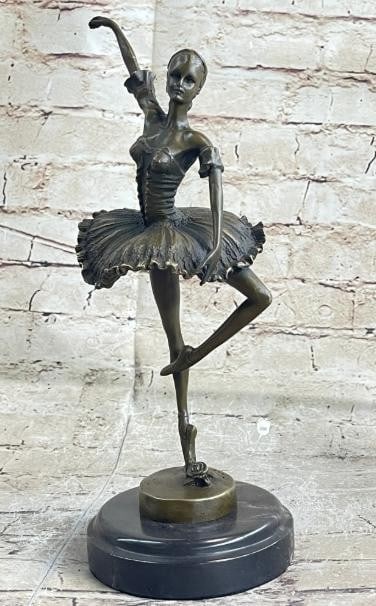 Poise in Motion Ballerina Bronze Sculpture: Poise in Motion Ballerina Bronze Sculpture Graceful and timeless, this is a finely detailed bronze sculpture of a young ballerina, captured mid-pose in a moment of serene elegance. With delicate featu