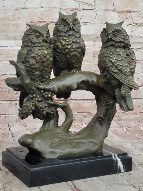 Wisdom in Threes: Bronze Owl Trio on Branch: Wisdom in Threes: Bronze Owl Trio on Branch This captivating bronze sculpture features three owls perched closely together on a textured branch, each with its own distinct pose and expression. Symboli