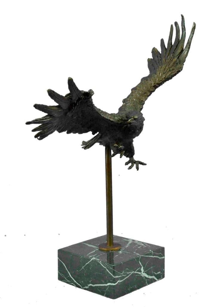 Wings of Vigilance American Eagle Bronze Sculpture: Wings of Vigilance American Eagle Bronze Sculpture A powerful and majestic bronze sculpture of an American eagle in mid-flight, created in the dynamic style of artist Milo and bearing his signature. W