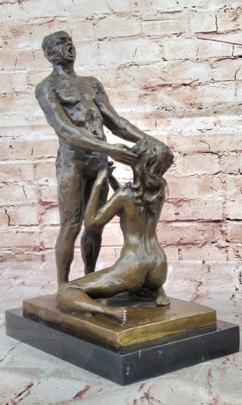 Bronze Sculpture of Love, Strength, and Vulnerability: Bronze Sculpture of Love, Strength, and Vulnerability This striking bronze sculpture bearing the signature of artist Olef Odegaard captures the profound intimacy between a standing male figure and a k