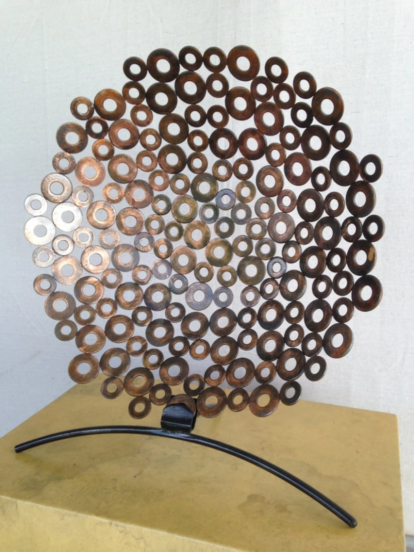 Abstract Round Metal Sculpture: Abstract Round Metal Sculpture Handcrafted with precision, this metal art bowl blends sculpture and form to create a timeless piece. Beyond its functional appeal, it serves as a striking artwork, enha