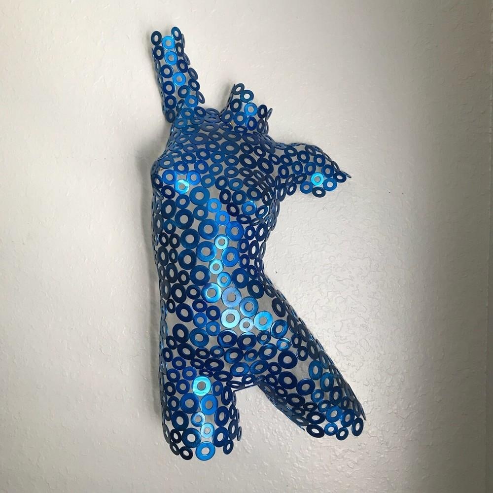 Reaching for the Center in Blue Metal Sculpture: Reaching for the Center in Blue Metal Sculpture This striking metal sculpture captures the elegance of the human form, hand-formed and welded with intricate detail. The female torso, finished in a ric