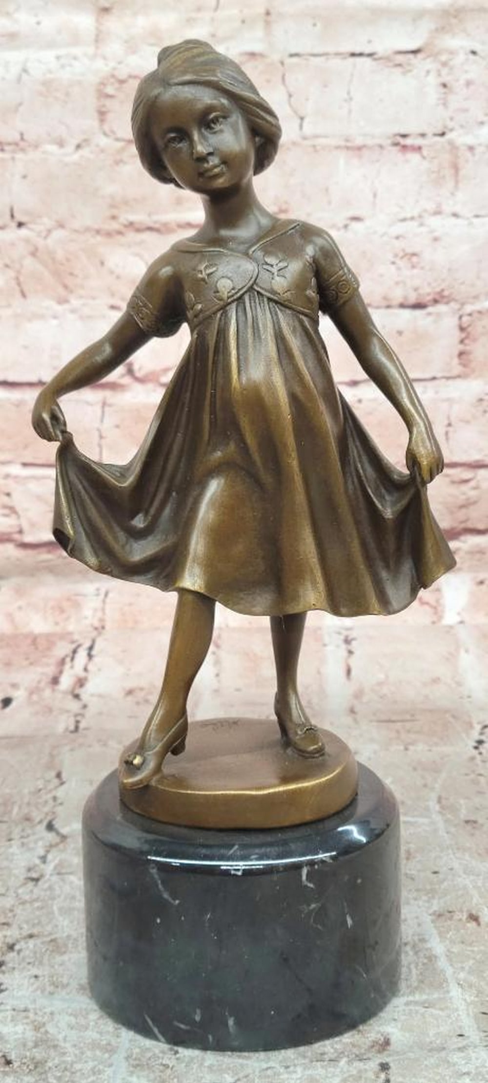 Milo Bronze Dancing Girl Sculpture - 11" x 4.5": Milo Bronze Dancing Girl Sculpture - 11" x 4.5" This original bronze sculpture by Milo depicts a young girl captured in a joyful moment of dance, with flowing movement and graceful form. The f