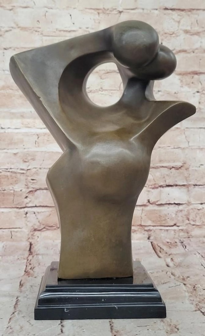 Eternal Embrace Abstract Bronze Lovers: Eternal Embrace Abstract Bronze Lovers This abstract bronze sculpture captures the intimate moment of two humans kissing, rendered with minimal detail and fluid, unified forms. The figures merge in a 