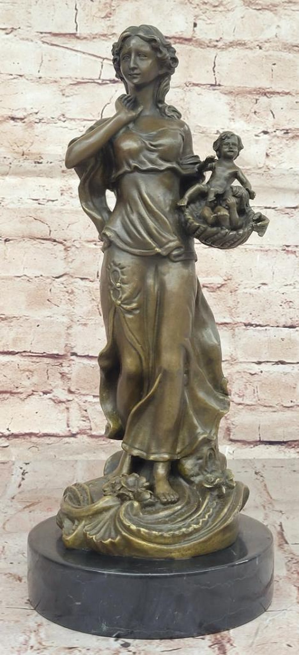 Nurturing Gaze Bronze Sculpture by Milo - 15.5" x 6.5": Nurturing Gaze Bronze Sculpture by Milo - 15.5" x 6.5" This touching bronze sculpture by Milo beautifully portrays a mother watching over her two babies nestled in a basket. Her tender express