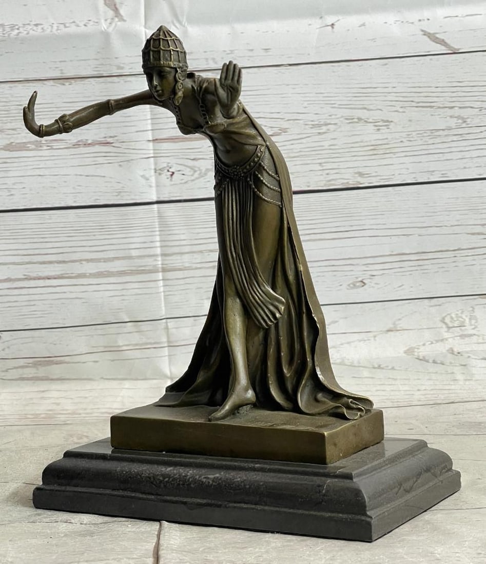 Dancing Egyptian Princess Bronze Sculpture - 12" x 5": Dancing Egyptian Princess Bronze Sculpture - 12" x 5" This Egyptian princess bows graciously with her hands out to her side as her long royal flowing dress cascades around down her legs and bu