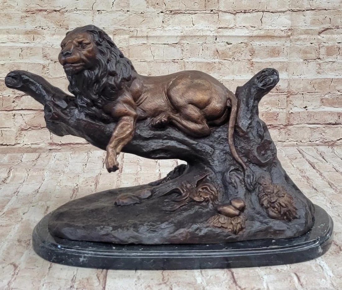 Resting Lion Inspired Bronze Sculpture by Moigniez - 13.5" x 20": Resting Lion Inspired Bronze Sculpture by Moigniez - 13.5" x 20" This striking bronze sculpture by the esteemed artist Moigniez captures the majestic presence of the king of the jungle.