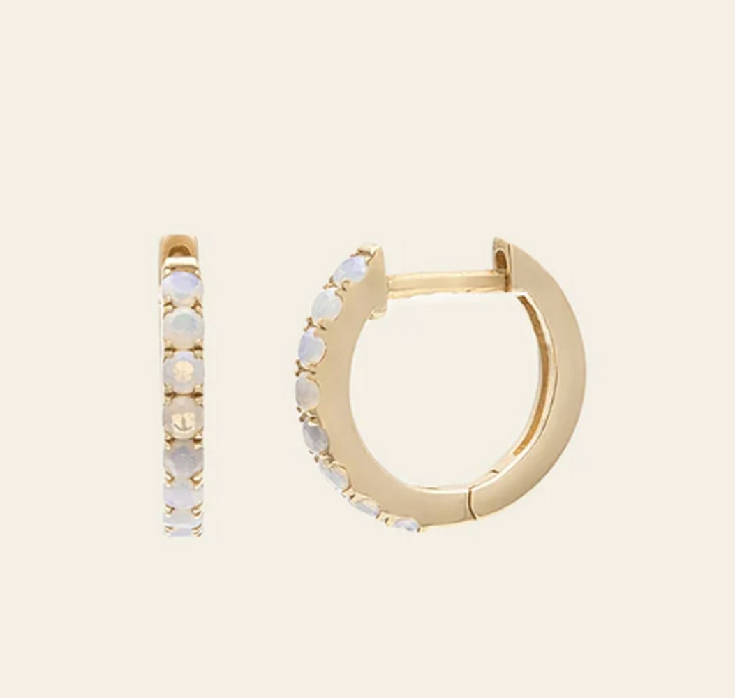 10k Solid Gold & Australian Opal Earrings: 10k Solid Gold & Australian Opal Earrings These 10K solid gold earrings feature luminous Australian opals, celebrated for their mesmerizing play of color. Set in a timeless design, the vibrant gem