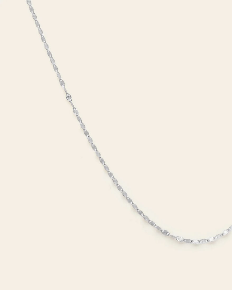 Sterling Silver Women's Stella Necklace: The sterling silver Stella necklace radiates modern elegance with its sleek design and polished finish. Perfectly versatile, this piece shines as a standalone accessory or layered with other