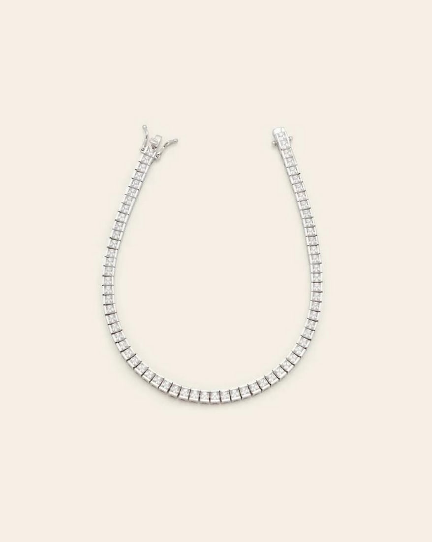 2.5mm Channel Set Tennis Bracelet in Sterling Silver: 2.5mm Channel Set Tennis Bracelet in Sterling Silver A true classic, designed with a channel setting and a detailed box clasp. This bracelet is sure to sparkle no matter how you wear it. Sterling Silv