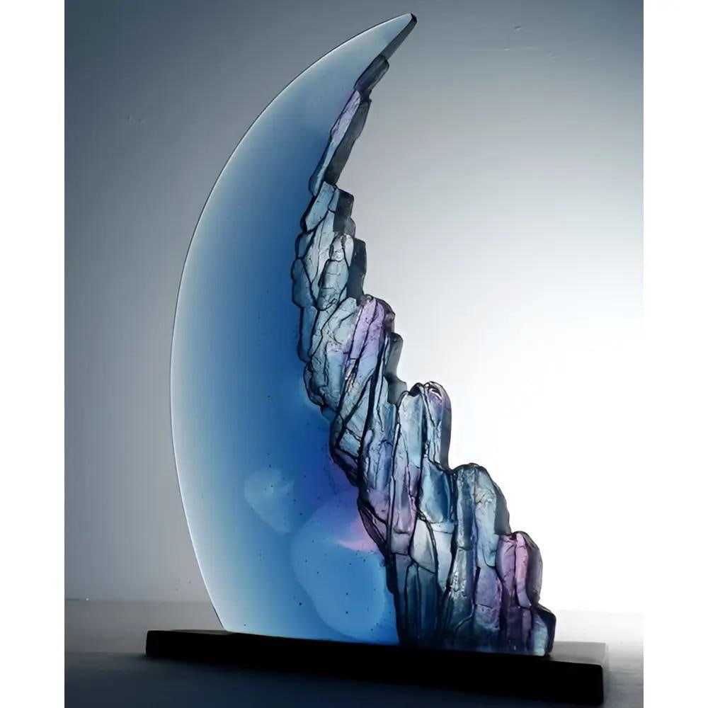 Blue Moon' Glass Sculpture by Crispian Heath: 'Blue Moon' Glass Sculpture by Crispian Heath Crispian Heath’s Blue Moon Sculpture captures the essence of an azure sea with craggy textures and seamless design, blending the ethereal beauty