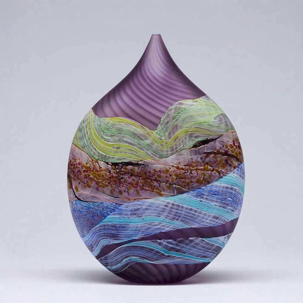 “Sea Shore Amethyst?? Teardrop Glass Vase by Thomas Petit: “Sea Shore Amethyst” Teardrop Glass Vase by Thomas Petit This hand-blown glass vase by Thomas Petit features a teardrop form designed to highlight flowing abstract patterns and layered colour