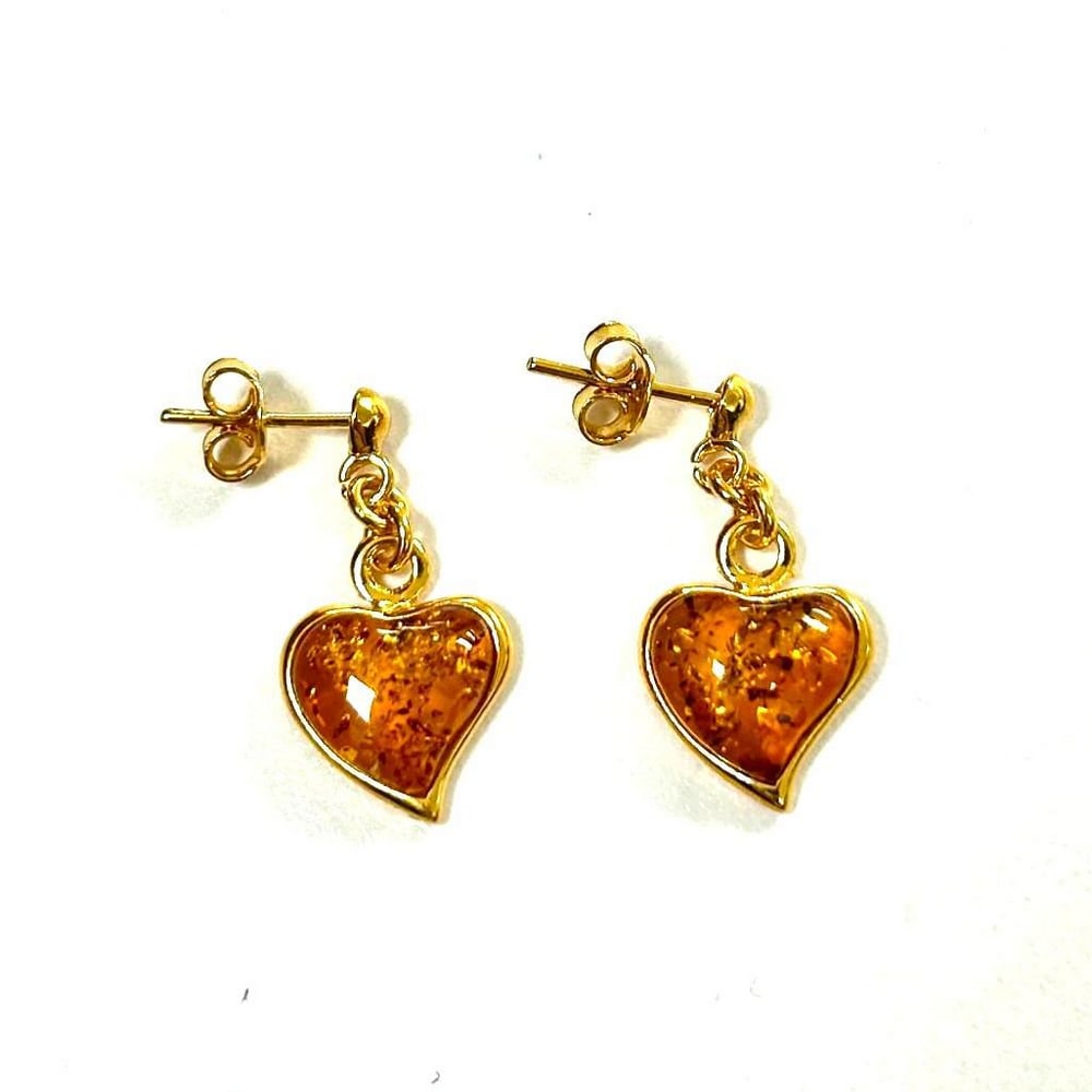 Golden Hearts Cognac Amber Gold Plated Stud Dangle Earrings: Golden Hearts Cognac Amber Gold Plated Stud Dangle Earrings The heart-shaped amber stones, with their rich cognac hues reminiscent of the setting sun, add a touch of romance and sophistication to the 