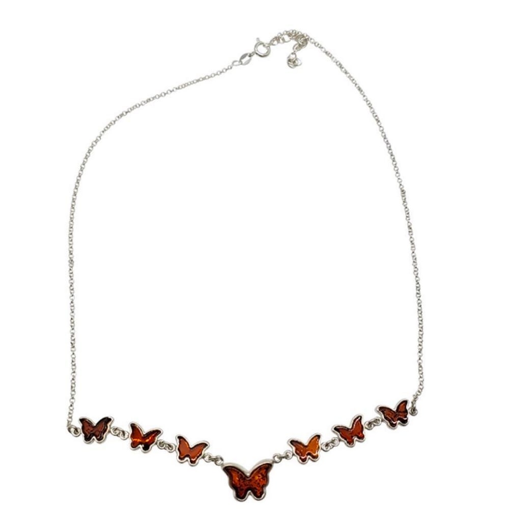 Whispering Wings Cognac Amber Sterling Silver Butterfly Necklace: Whispering Wings Cognac Amber Sterling Silver Butterfly Necklace Hung from a sterling silver chain, this necklace is designed to gracefully drape around your neckline, adding a touch of whimsy and sop
