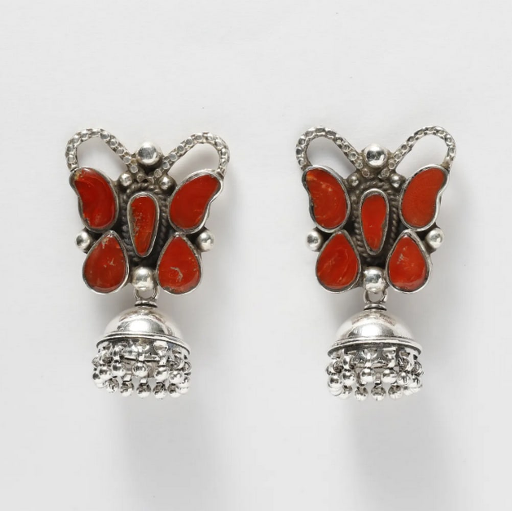 Mystic Coral Butterfly Jhumkis: Mystic Coral Butterfly Jhumkis These butterfly-shaped jhumki earrings blend traditional Indian craftsmanship with modern elegance. Featuring intricately crafted silver butterflies adorned with vibrant