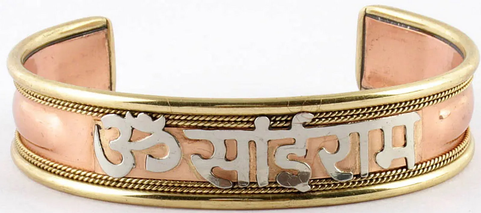 OM Sai Ram Copper Alloy Bracelet: OM Sai Ram Copper Alloy Bracelet This copper alloy bracelet features the sacred etching of “Om Sai Ram,” a name believed to dispel negativity and promote spiritual well-being. Crafted from