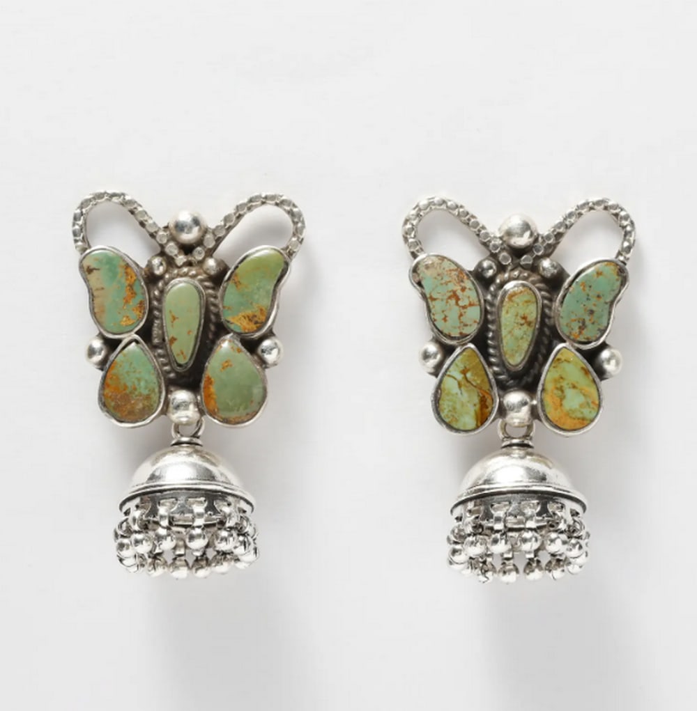 Turquoise Butterfly Sterling Silver Jhumki Earrings: Turquoise Butterfly Sterling Silver Jhumki Earrings Elegant and artfully crafted, these jhumki earrings feature a butterfly design with vibrant Tibetan turquoise stones set against polished sterling