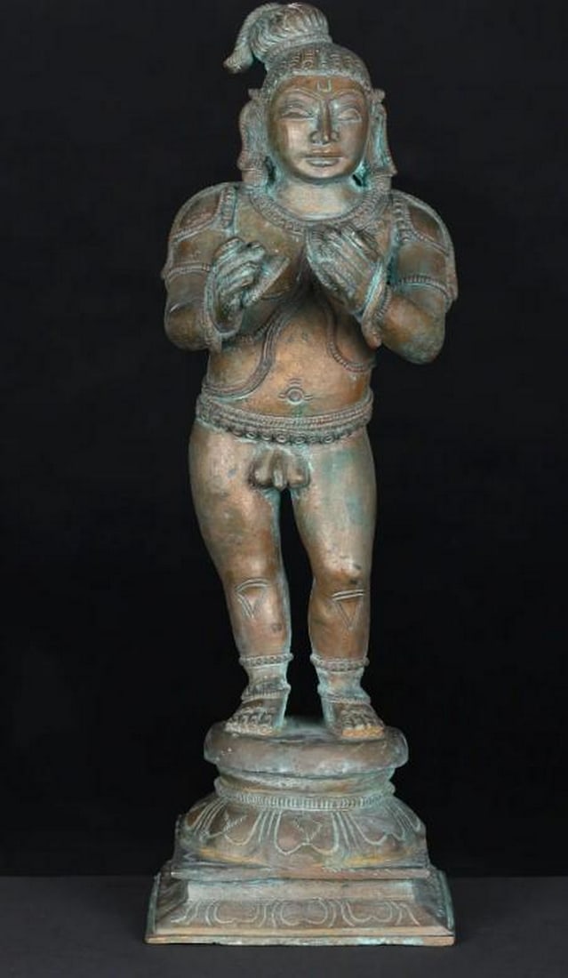 11" Lord Krishna Bronze Statue: 11" Lord Krishna Bronze Statue This magnificent bronze statue of Lord Krishna captures the divine charm of the beloved deity. Depicted in a graceful pose, Krishna radiates serenity and joy.