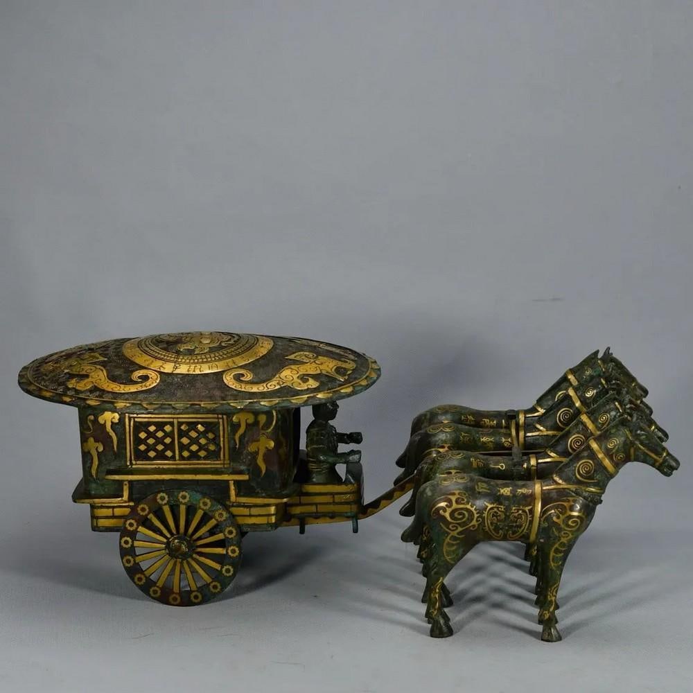 Antique Bronze Horse-Drawn Carriage with Gold Inlay: Antique Bronze Horse-Drawn Carriage with Gold Inlay This exquisite Chinese antique bronze statue depicts a horse-drawn carriage adorned with delicate gold inlay. Entirely hand-made, the sculpture
