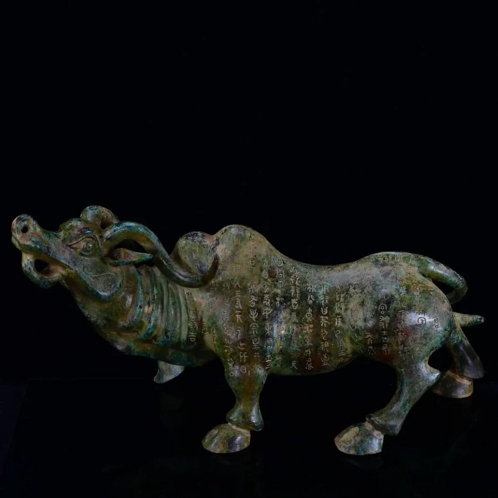 Antique Bronze Bull with Silver Inlay: Antique Bronze Bull with Silver Inlay This impressive Chinese antique features a large hand-crafted bronze bull adorned with intricate silver inlay. Symbolizing strength, prosperity, and determination