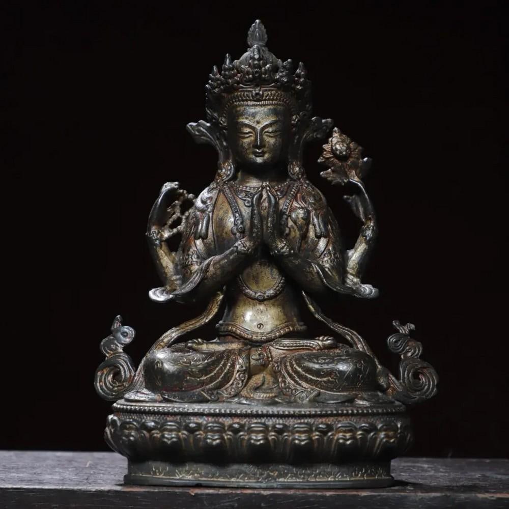 Mud Gold Four-Armed Guanyin Buddha Statue: Mud Gold Four-Armed Guanyin Buddha Statue This exquisite statue of the Four-Armed Guanyin, the Bodhisattva of Compassion, is crafted from rare pure copper and features a unique mud gold finish. Handcr