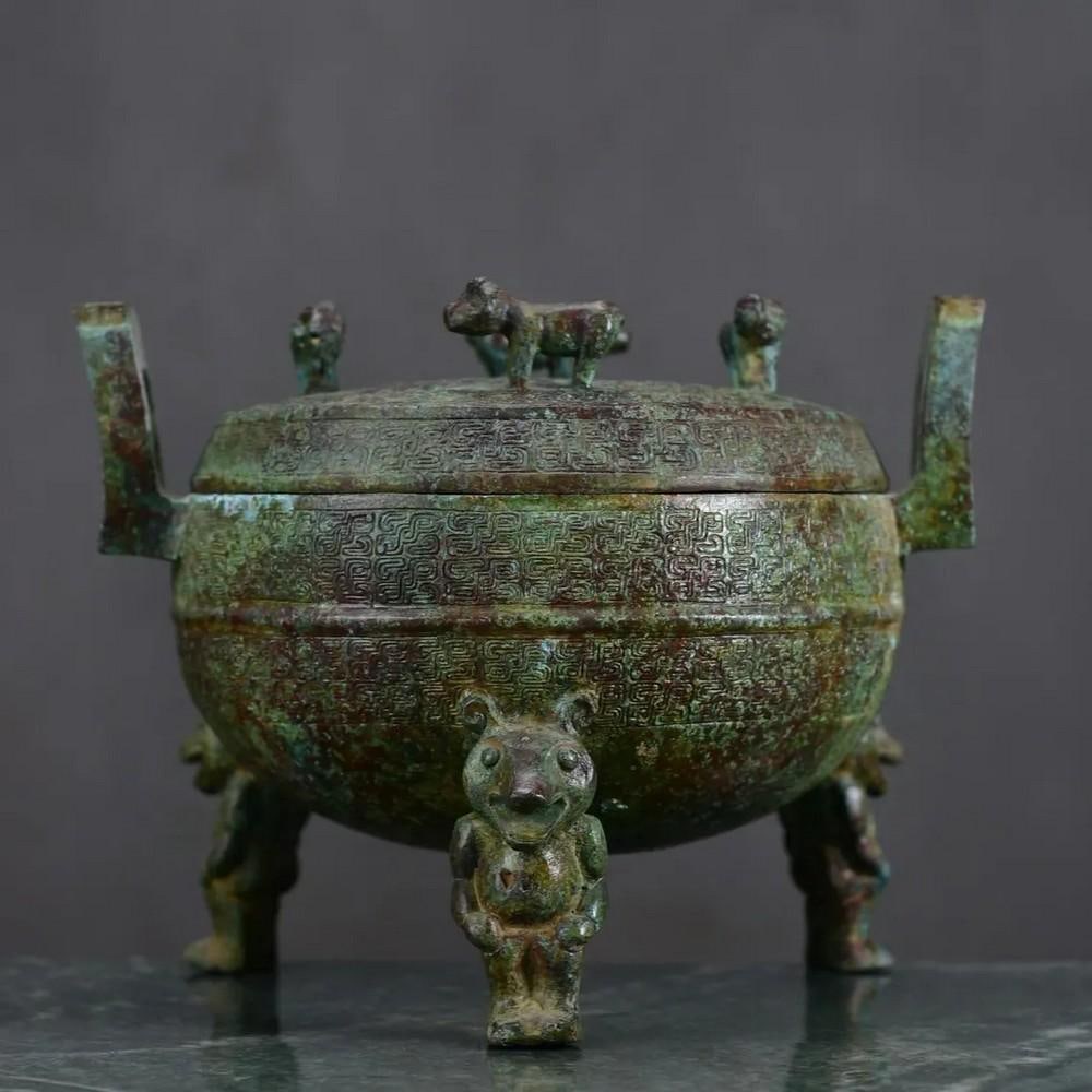 Antique Bronze Bear Foot Tripod Statue: Antique Bronze Bear Foot Tripod Statue This rare Chinese antique features a hand-crafted bronze tripod with unique bear feet, symbolizing strength, protection, and connection to nature. The detailed c